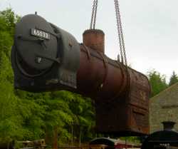 Locomotive J21 boiler removal in progress. Locomotive J21 removal of boiler.